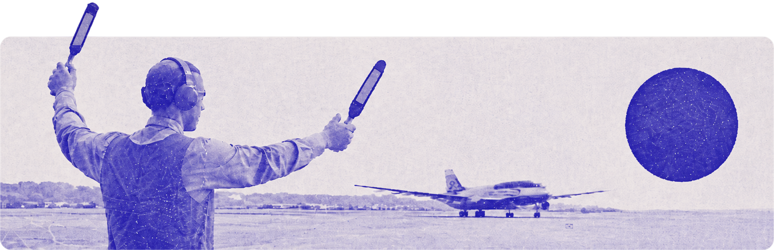 Aircraft marshaller guiding a plane on the runway